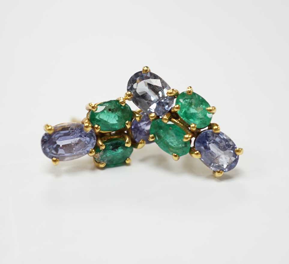 A modern pair of 18ct gold, two stone emerald and two stone sapphire set ear studs, 15mm by 7mm, gross weight 3 grams.